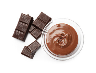 Tasty chocolate butter in glass bowl and pieces isolated on white, top view