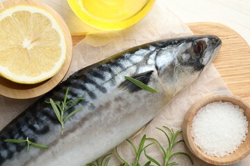 Fresh raw mackerel and spices on table, flat lay. Seafood delicacies