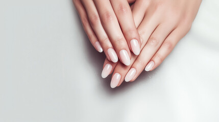 Naklejka premium beautiful woman's hands with light pink manicure on the nails.