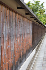 A view of the old-fashioned wall made with bamboo.  Kyoto Japan
