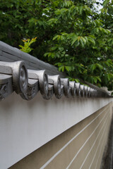 A view of the old-fashioned wall roof with tile.  Kyoto Japan
