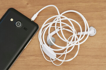 a smartphone with earbuds