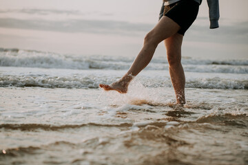 woman walking on water at sea