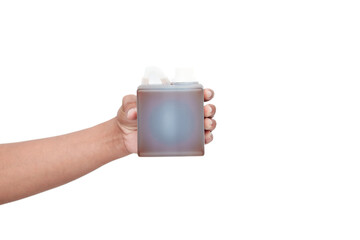 Hand Holding a Bottle of Brown Liquid