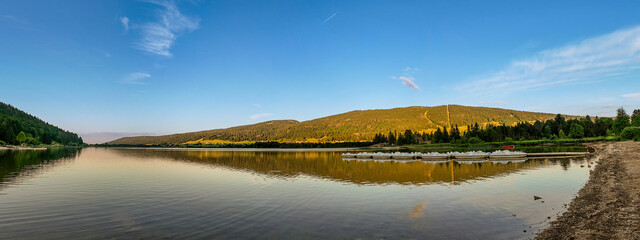 Golden Sunset Panorama at Lac des Rousses with Paddle Boats – Jura Mountains, France