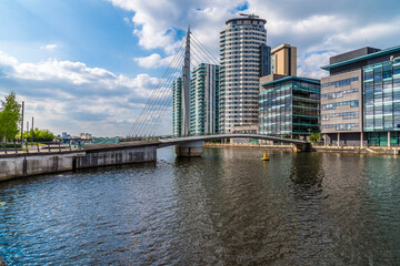 A view along the Manchester ship canal towards a footbridge leading to Media City,  Manchester,UK...