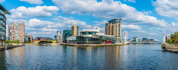 A panorama view down the Manchester ship canal towards Salford Quays,  Manchester,UK in summertime