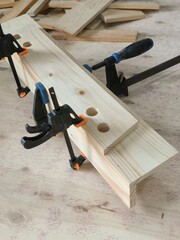 Clamps hold the wood together