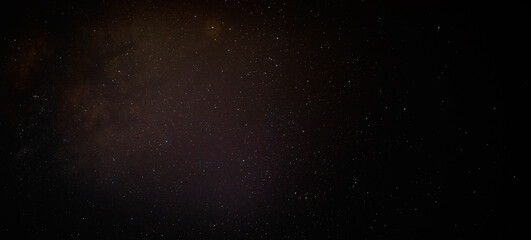 Starry night sky ikn North Carolina with cluster or red stars