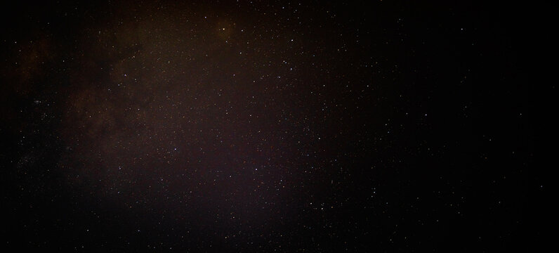 Starry night sky ikn North Carolina with cluster or red stars