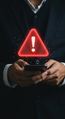 Smartphone alert with red warning triangle icon. Professional hands holding phone with caution symbol. Digital notification with exclamation mark.
