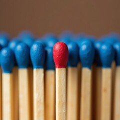 Unique Red Matchstick Among Blue Ones: A Standout Concept