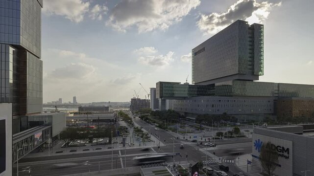 sunny day abu dhabi city hospital exterior traffic street crossroad rooftop panorama timelapse 4k united arab emirates  
