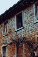 Abandoned Stone House with Overgrown Vines