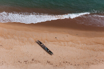 Aerial photograph of a dugout on a lonely stretch of beach near Robertsport, Liberia.
