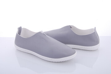 Stylish gray slip-on shoes designed for comfort and versatility, perfect for casual outings and...