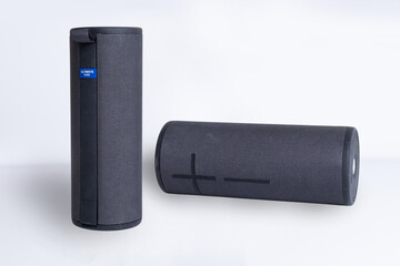 Portable Bluetooth speaker designed for outdoor enjoyment, featuring a sleek cylindrical shape and durable fabric covering