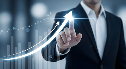 Businessman touching a virtual screen with a rising arrow and graph. Symbolizes business growth, success, strategy, investment, and financial improvement.