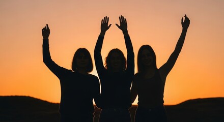 Three women celebrate friendship against a vibrant sunset backdrop
