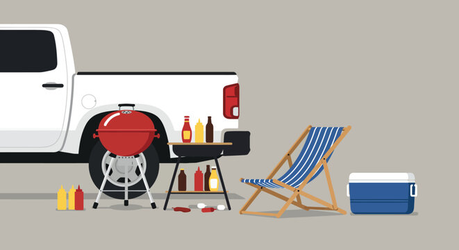 A white pickup truck is parked with its tailgate down, hosting a barbecue setup with grills, a cooler, and a striped beach chair, suggesting a fun and relaxed outdoor gathering