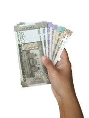 Hand holding Indian currency notes of ₹10, ₹50, ₹100, and ₹500. Indian currency, economy, savings, budget, investment.