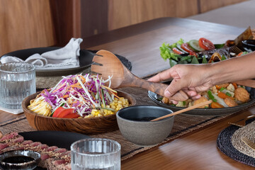 A sumptuous array of lunch offerings on a luxury Phinisi yacht in Labuan Bajo, featuring a diverse...