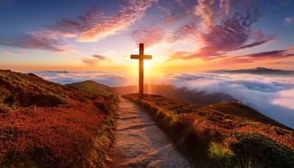 sunset over a path with a cross amidst vibrant clouds and fog in a serene landscape