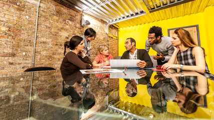 The Media Agency: Planning Meeting. A candid view of a project team meeting of creative...