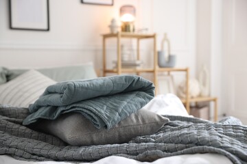 Fresh linens on bed indoors. Home textile