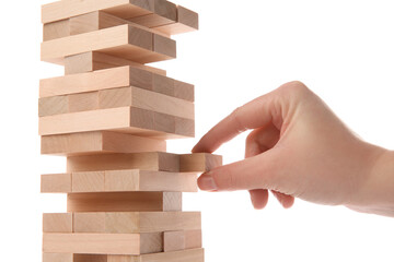 Lviv, Ukraine - December 05, 2023: Woman playing Jenga on white background, closeup