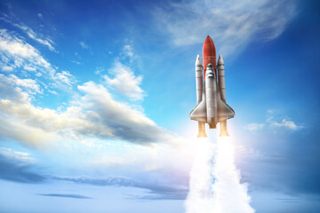 Modern space rocket in beautiful blue sky