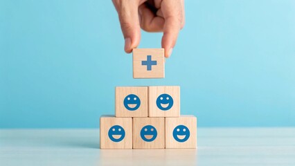 Hand chooses a emoticon icons healthcare medical symbol on wooden block , Healthcare and medical Insurance concept