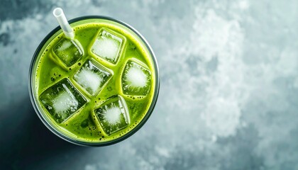 A refreshing green matcha drink with ice cubes, perfect for a hot day