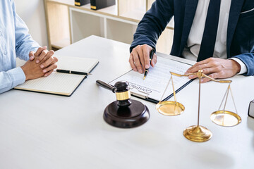 Businesswoman and Male lawyer or judge consult and conference having team meeting with client at...
