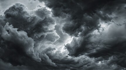 A dramatic sky filled with dark and ominous storm clouds creating a powerful atmospheric scene