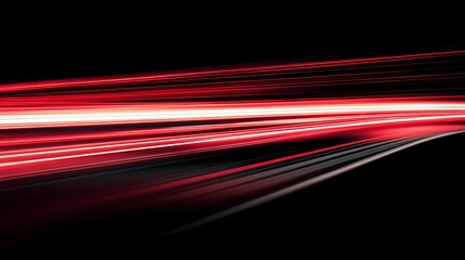 Abstract red light streaks on a dark background creating a sense of speed and movement in the image