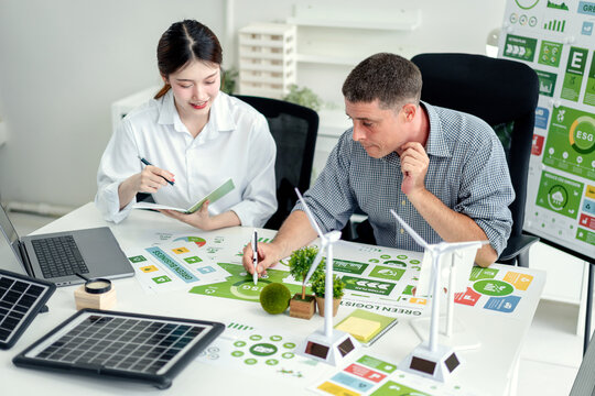 Business Professionals Collaborating on ESG Green Strategy for Environmental Sustainability and Carbon Reduction Goals