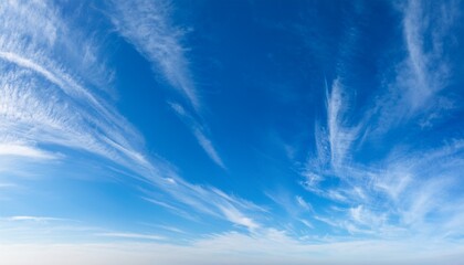 blue sky panorama with feathery cirrus clouds and copy space windy weather
