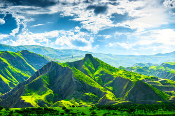Picturesque mountain landscape with green mountains and dramatic sky. Dagestan, Caucasus