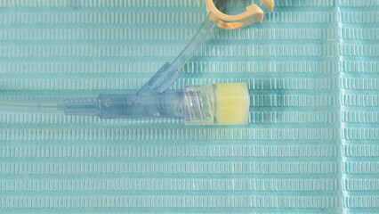 Top view of the rubber injection port on a Huber (gripper) needle tubing. Positioned on a sterile...