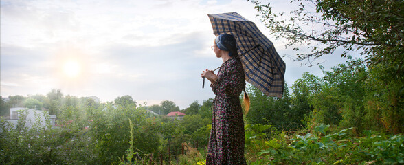 Young girl with big umbrella