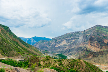 Obraz premium Dramatic landscape of a mountain river valley among the beautiful rocky mountains of the North Caucasus of Dagestan. Russia