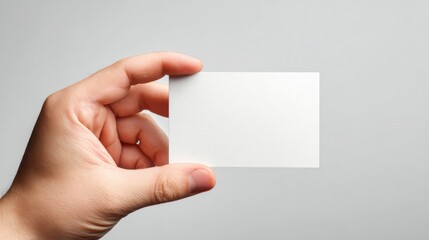 Obraz premium Hand Holding Blank Business Card with Clean Background