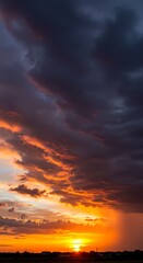 Fototapeta premium Dramatic sunset over cloudy horizon