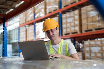 Warehouse and male worker working with laptop computer for inspection, inventory and checking stock, distribution, logistics in warehouse
