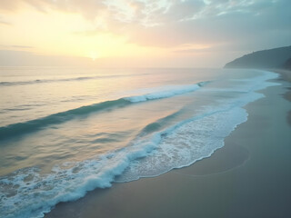 Obraz premium Serene sunrise over a tranquil beach, gentle waves lapping the shore.