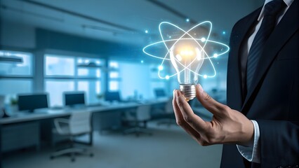 Businessman holding a glowing light bulb with an atomic structure overlay symbolizing innovation and new ideas