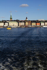 Stockholm Gamla stan panorama from a boat on the lake Mälaren departing towards archipelago. Spring sunny day with blue sky in capital city of Sweden.