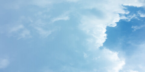 Blue sky, sun, clouds. A peaceful moment with underlying complexity. A reflection of the sky on thin clouds. Hidden emotions beneath a bright exterior like feeling melancholic on a good day background