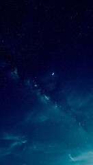 Fototapeta premium Vast starry night sky with crescent moon and milky way galaxy